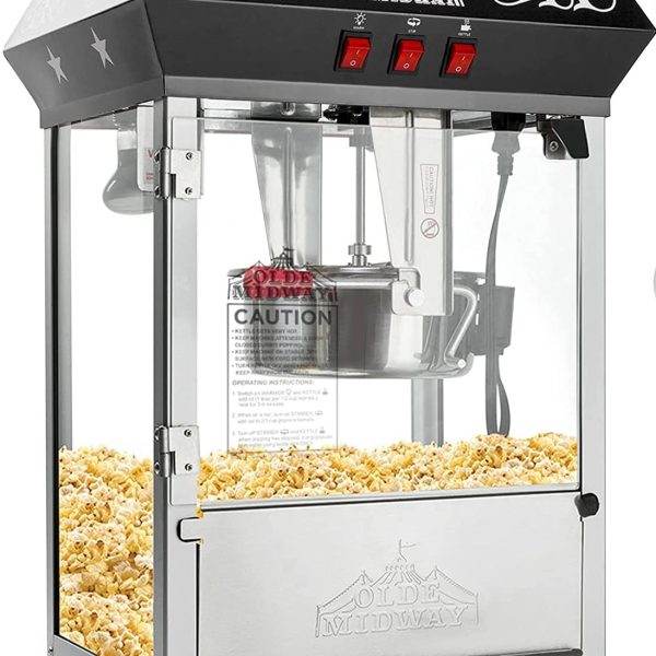 A Slime popcorn machine with a star on it, ideal for an outdoor movie party, filled with popcorn. The top features decorative black accents and warming lights.