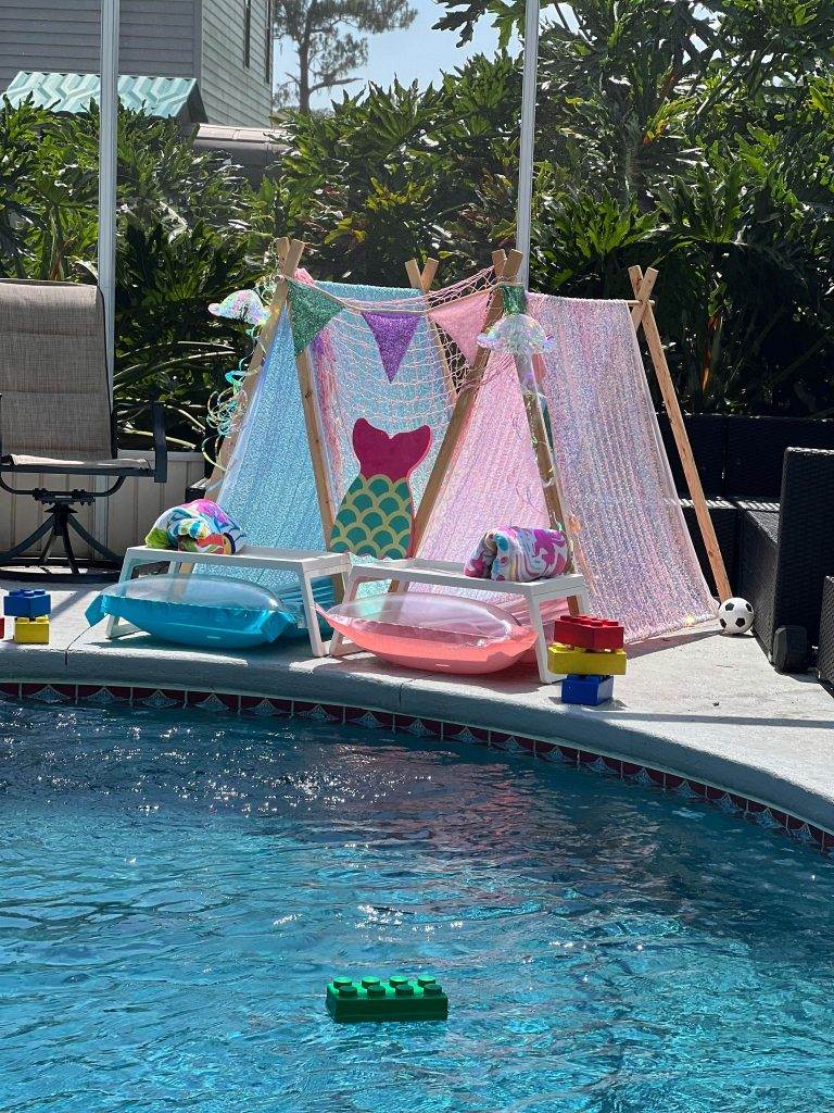 A pool with a mermaid teepee.
