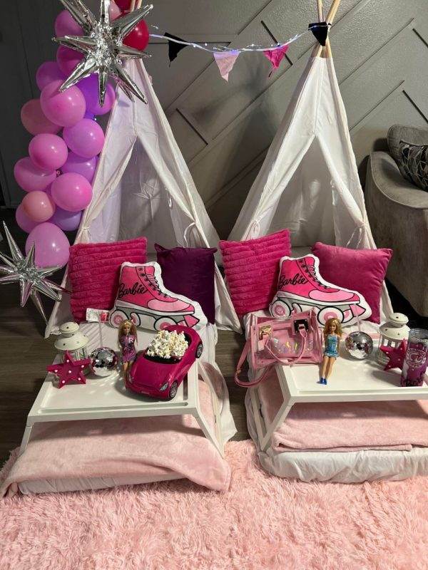 Two pink Bell Tent teepees with pillows and balloons, perfect for a festive party in picturesque Lakeland.